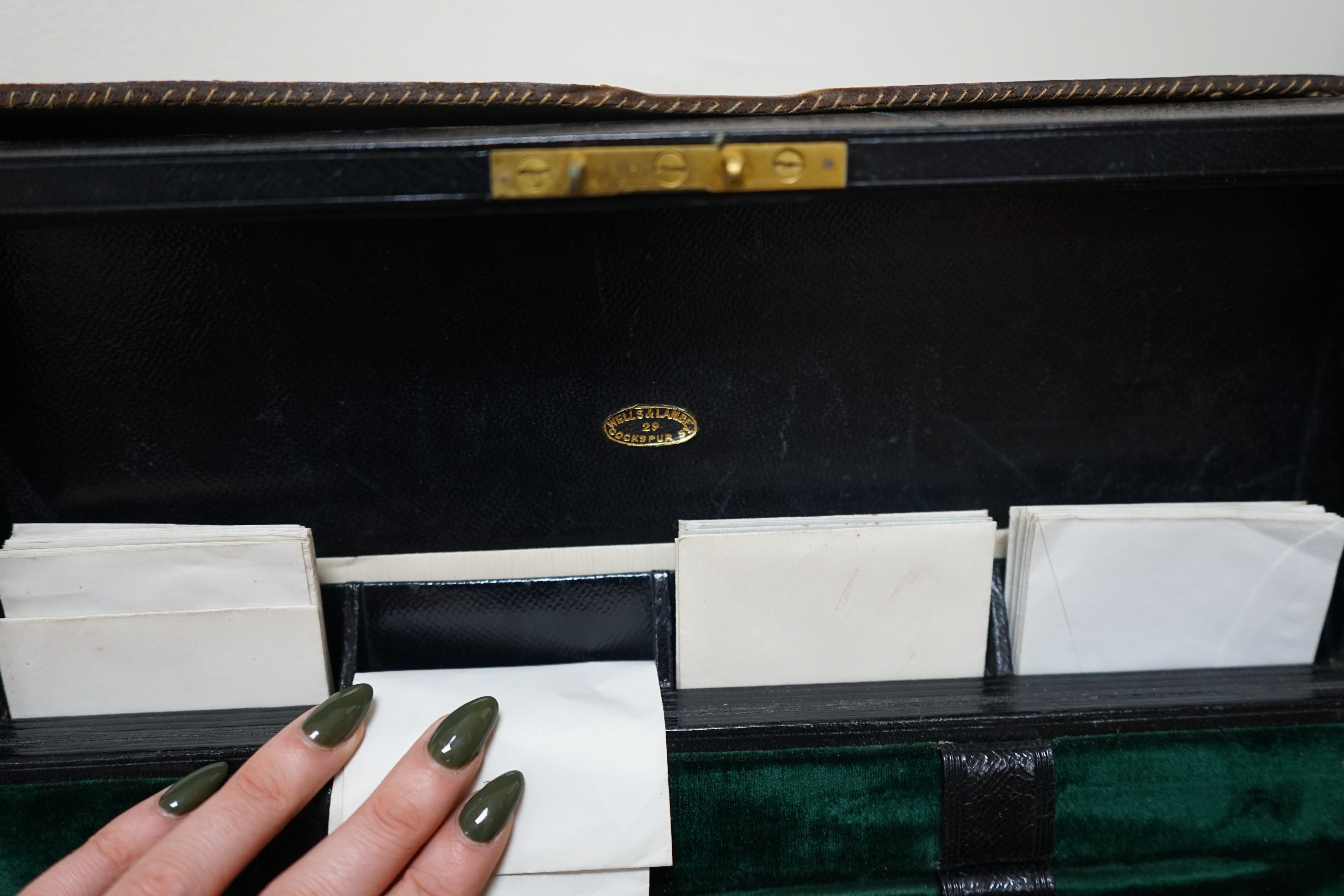 Wells & Lambert, London, a travelling writing box and outer leather case, with Bramah lock and keys, with monograms and inscriptions of Rev. George A. Robins, the box incorporating a silver lidded inkwell, 33cm wide. Con